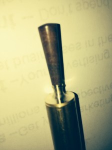 The brass-wood handle after turning