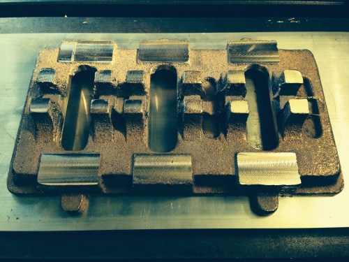 The base, with 6 pillar mounting areas machined parallel & coplanar, and the crankshaft mounting blocks after an initial skimming.