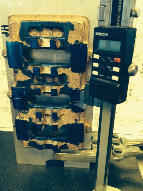 Using a Knu vice to cramp the base plate to and angle plate, and a height gauge to mark the reference lines