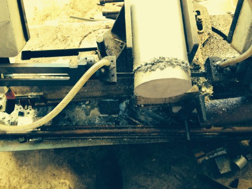 16kg aluminium rod.  Cutting off using a band saw.