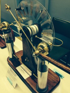 Wimshurst Electrostatic Generator, made by Peter Bodman.  Creates sparks up to 100mm long, which drill minute holes in interposed paper sheets.  No-one volunteered to ry it with a hand.