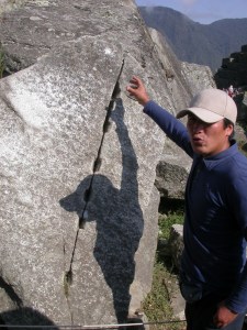 Our guide at the MachuPicchu quarry explains how the Inca stonemasons chipped rectangular slots then hammered in wedges, or allowed water to freeze and expand, to split the stone.  