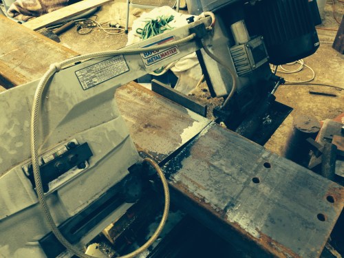 Cutting the channel with the drop band saw.