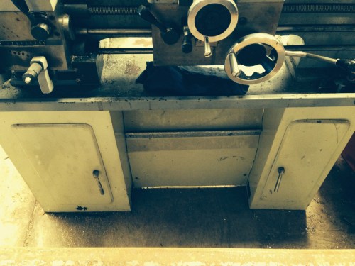 The lathe on its original cupboard base
