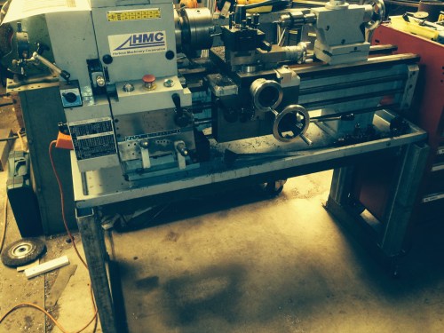 The new base.  The channel is barely visible under the lathe bed and behind the legs.