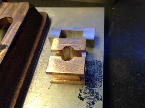 One of the 6 main bearings and caps.  The hole has been roughed out, ready for accurate boring 