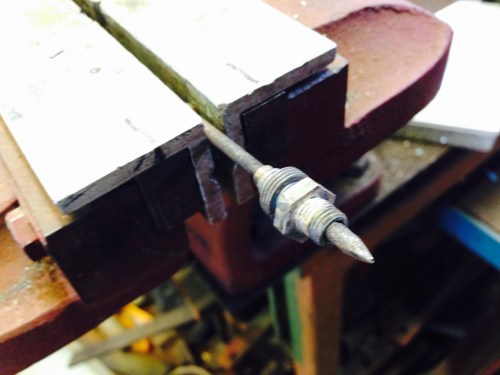 The coolant fitting and its broken thread, fluxed and ready for silver soldering.