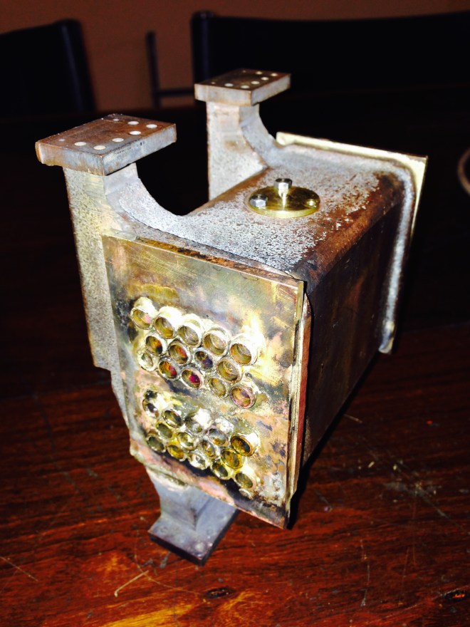 The water tubes silver soldered to the end plate.  The first end soldered, and it had multiple leaks...