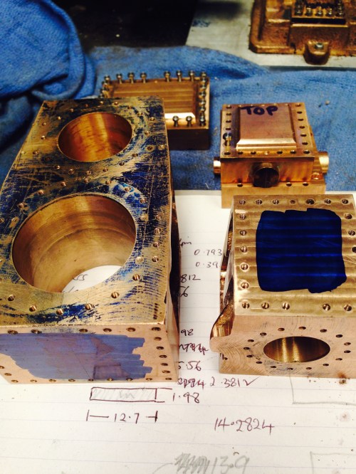 The cylinder blocks, painted with marking out paint, ready for marking.