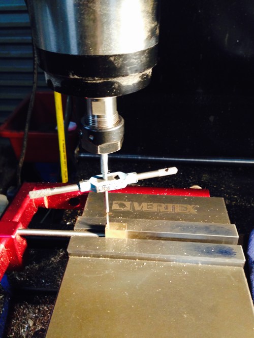 Tapping the BA10 thread.  Note the Protech vice stop, and the spring loaded centering tool.