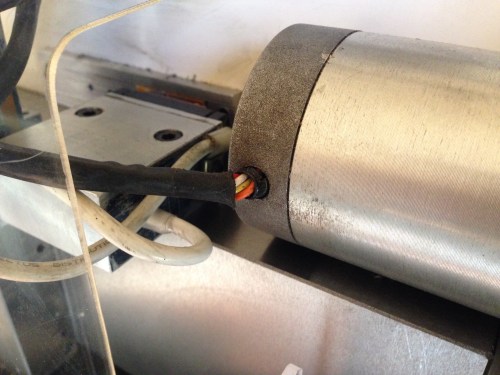 The before.  This the Z axis stepper motor on my Boxford CNC lathe.  The lathe is 30 years old, so it is not too surprising that the plastic cable coating is becoming stiff and peeling back.