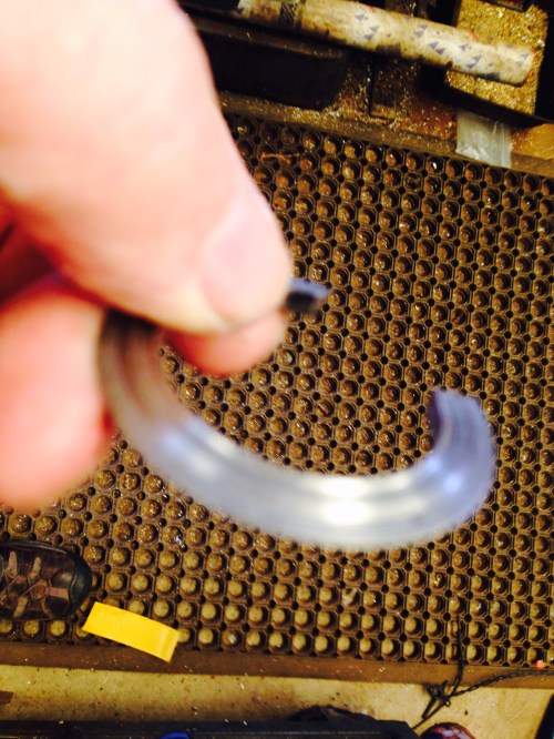 The knife edge, split ring, used to dislodge the bearing race. (seen here in its expanded state.)