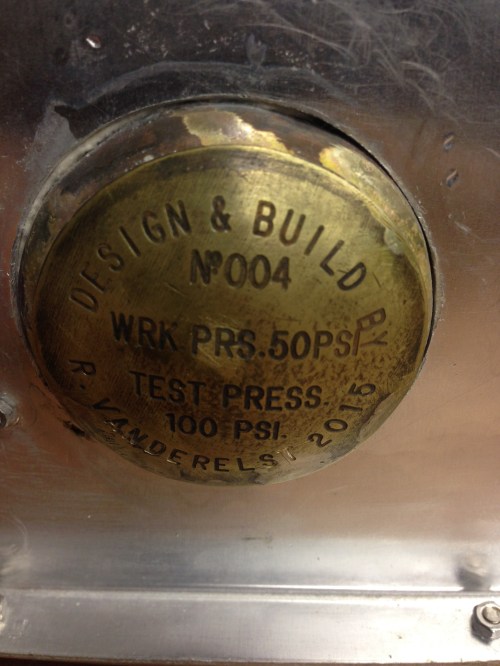 Rudy made the nameplate on an engraving machine, then formed the domed shape.