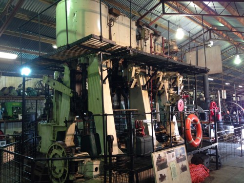 The triple expansion marine engine. It powered a tug boat originally. It is steam powered, but only the high and intermediate pressure cylinders are currently powered. The condenser is not fitted to the engine because of the large volume of water it consumes, so the low pressure cylinder is not powered. The rotation of the engine is slightly irregular because only 2 of the cylinders are powered, but it is still a mightily impressive sight.